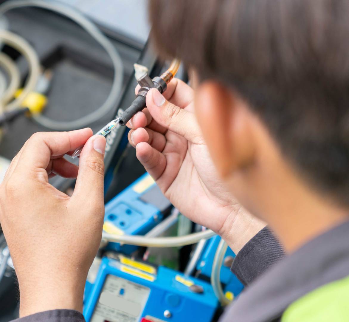 Technician ware sampling tube air quality in reel of machine pump for measurement