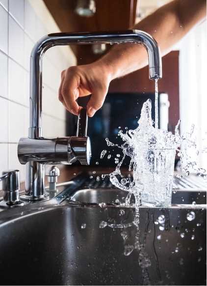 This is an image of faucet filling a glass of water