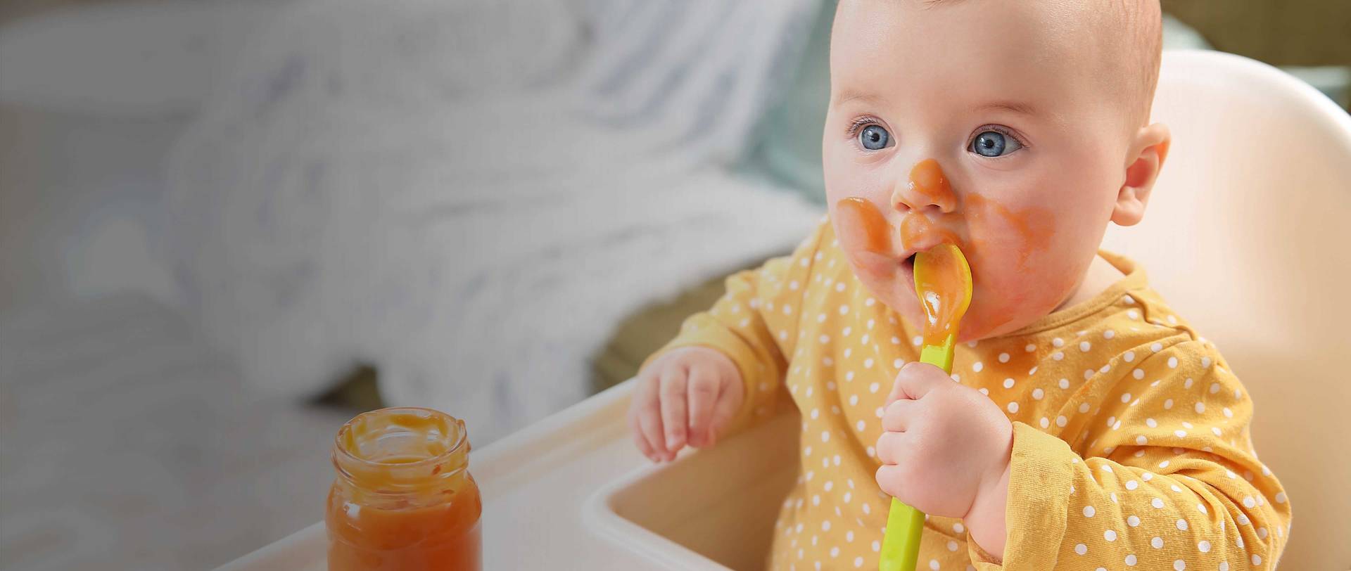 Home Page Carousel Hero - baby eating carrot baby food