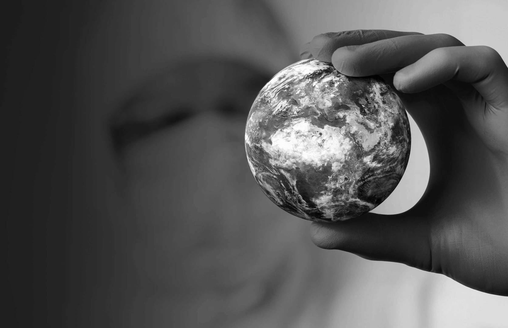 Scientist holding globe