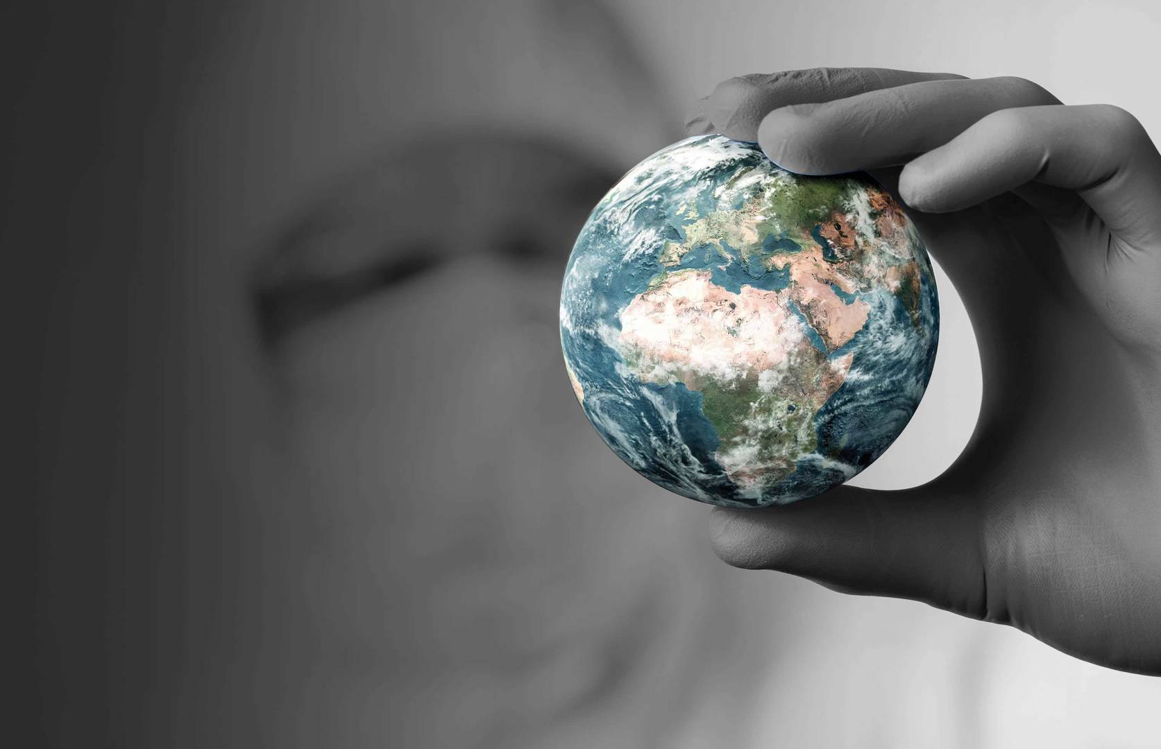 Scientist holding globe