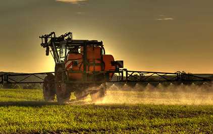 Farmer spraying pesticides